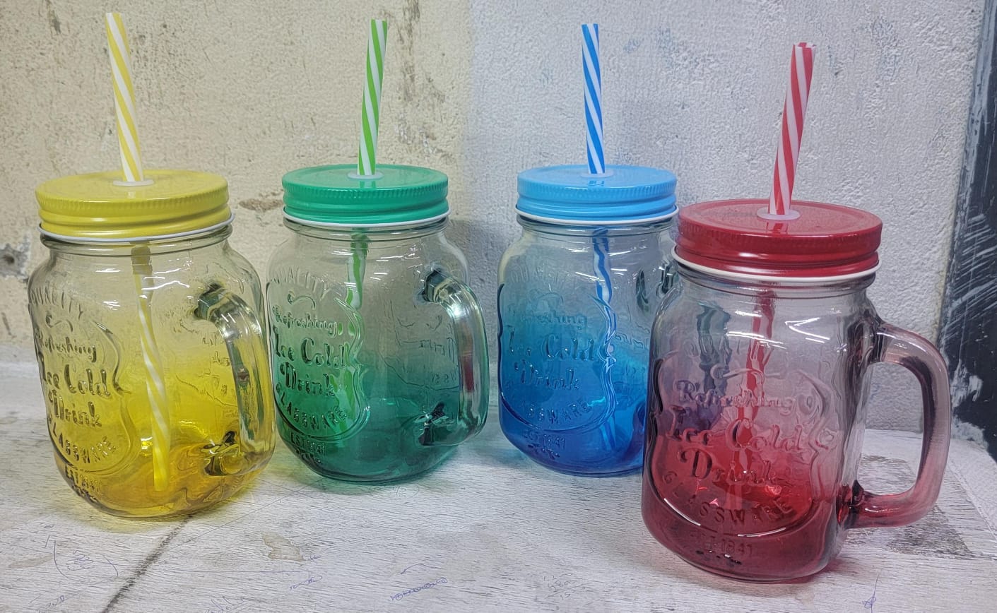GLASS SMOOTHIE JARS. Used in home canning to preserve food; while the bands are reusable, the lids are intended for single use when canning.