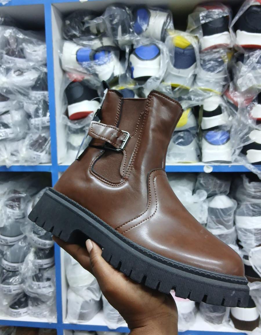 Girls Boots size 25-36 Leather-look Ladies boots with a black lug sole, side buckle detail, and a pull tab