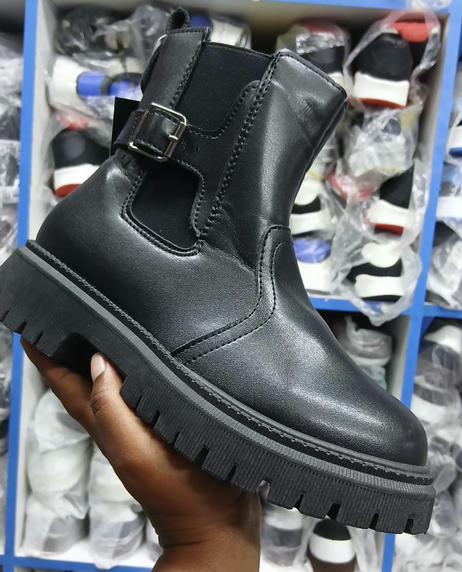 Girls Boots size 25-36 Leather-look Ladies boots with a black lug sole, side buckle detail, and a pull tab