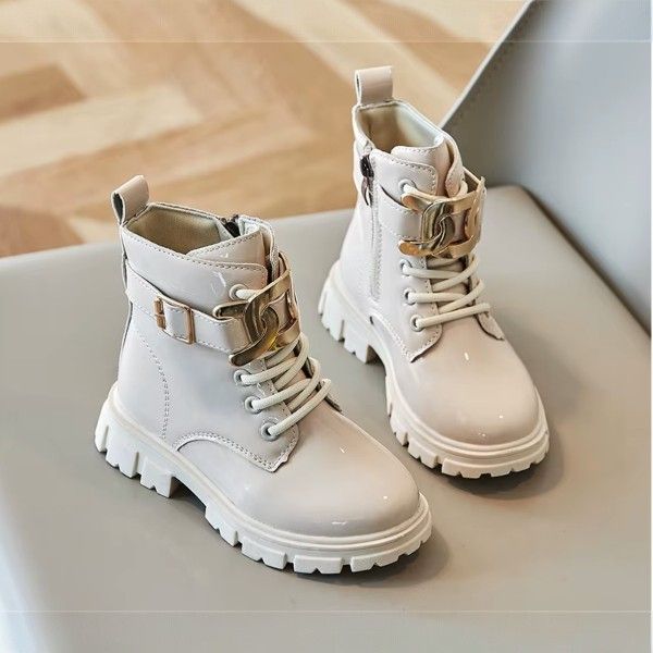 Kids Fashion boots size 25-30 pair of ankle boots with a chunky sole and a decorative side pocket detail.