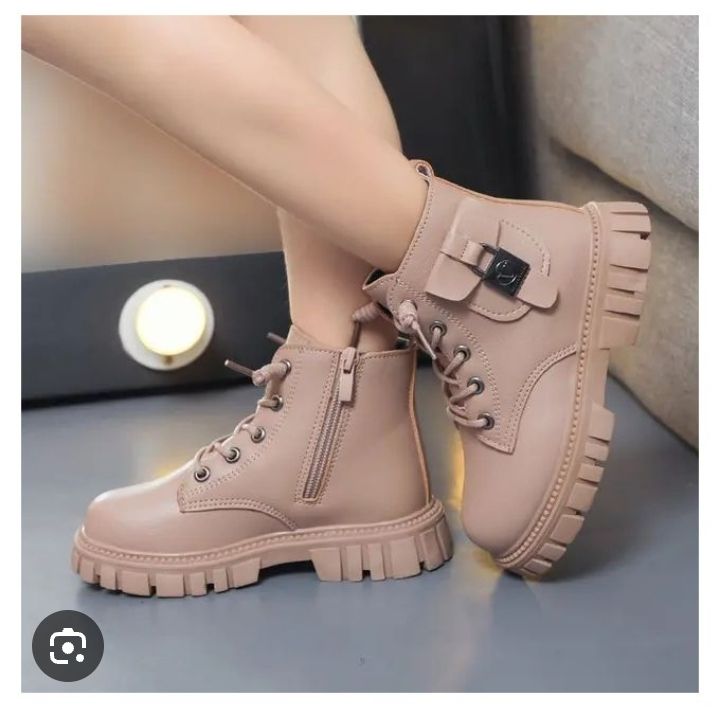 Kids Fashion boots size 25-30 pair of ankle boots with a chunky sole and a decorative side pocket detail.