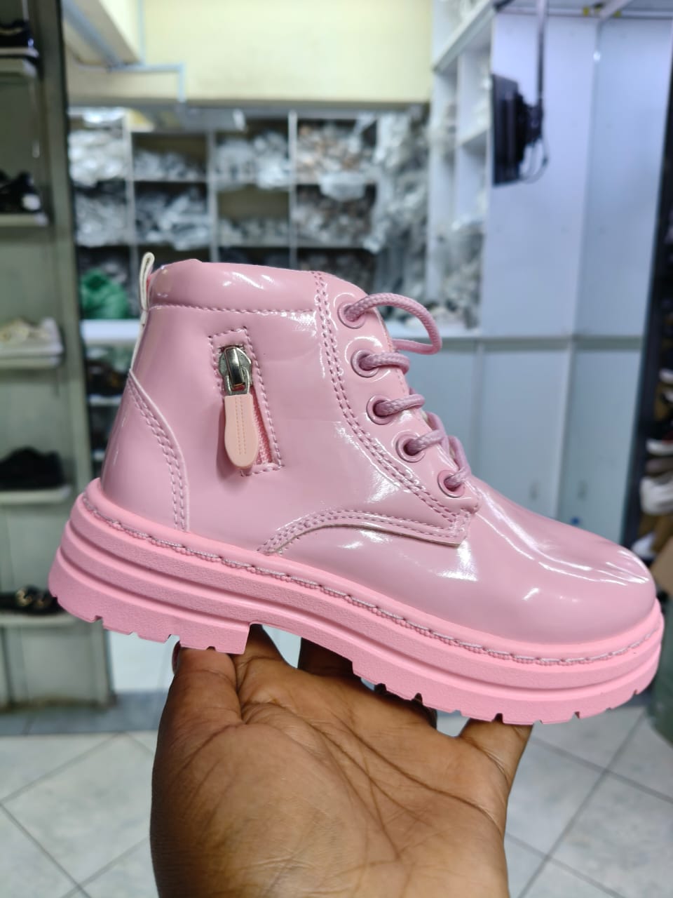 Boot girls size 25-36 patent leather kids' combat boots with a lace-up front and a side zipper closure.