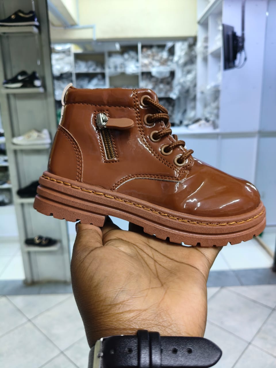 Boot girls size 25-36 patent leather kids' combat boots with a lace-up front and a side zipper closure.