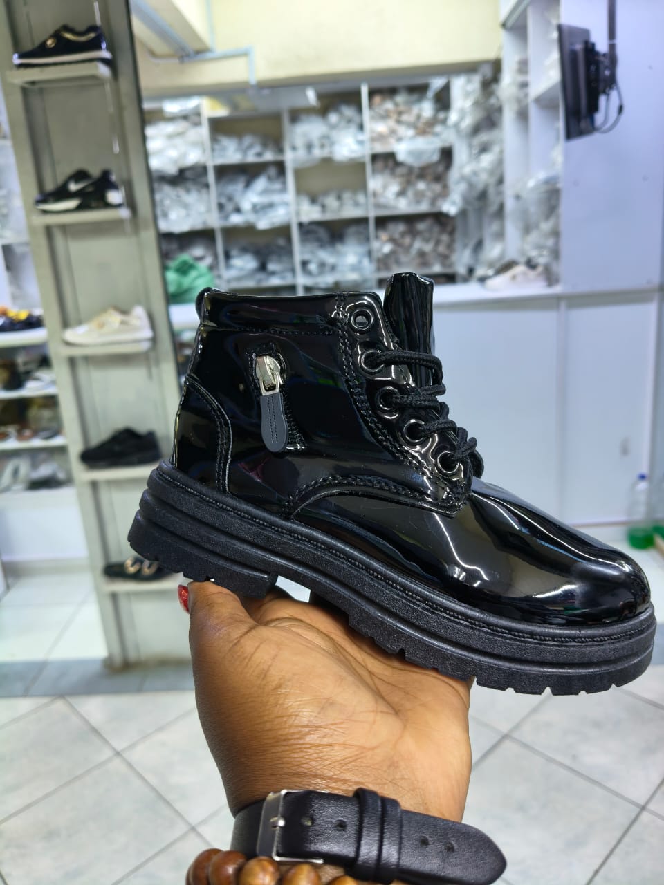 Boot girls size 25-36 patent leather kids' combat boots with a lace-up front and a side zipper closure.