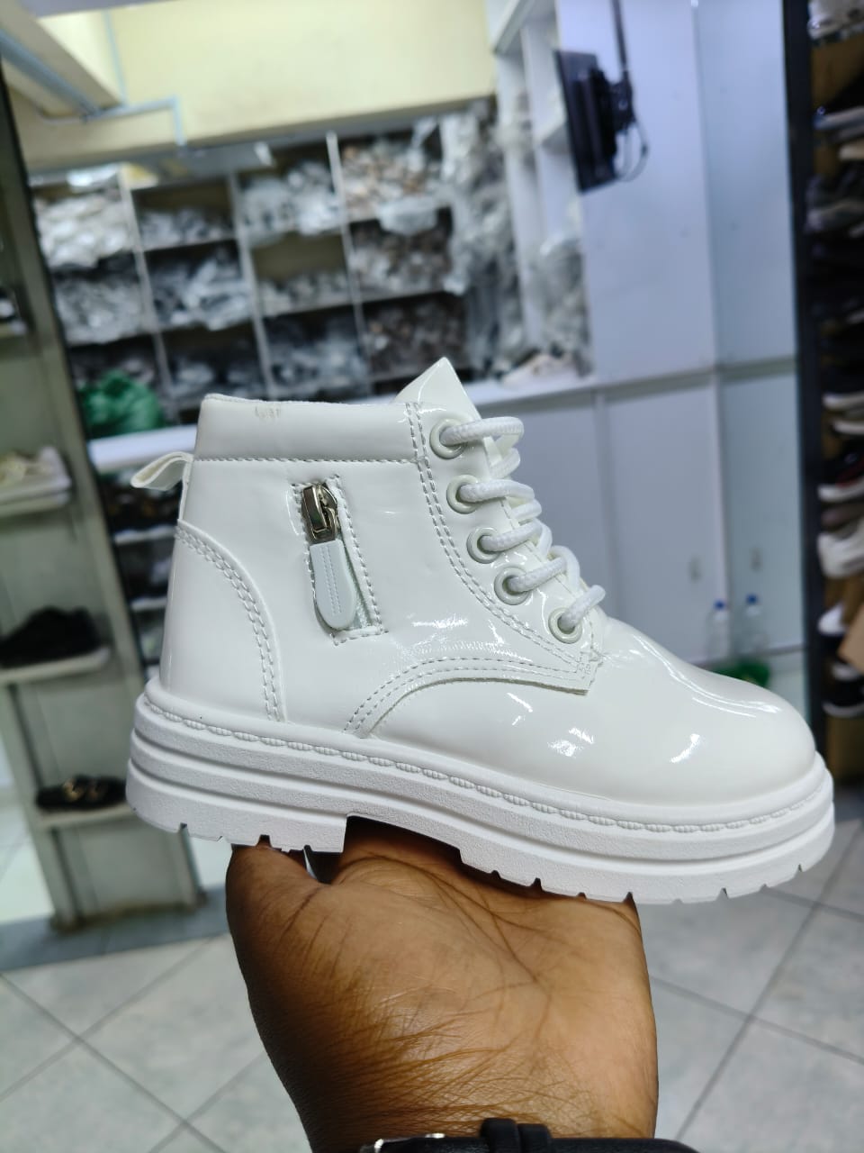 Boot girls size 25-36 patent leather kids' combat boots with a lace-up front and a side zipper closure.