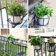 Metallic over the balcony flower pot holder,designed to maximize gardening space in apartments or homes with limited outdoor areas