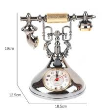 Retro telephone alarm clock decorative table ornaments designed to resemble classic rotary dial telephones.