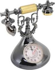 Retro telephone alarm clock decorative table ornaments designed to resemble classic rotary dial telephones.