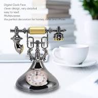 Retro telephone alarm clock decorative table ornaments designed to resemble classic rotary dial telephones.