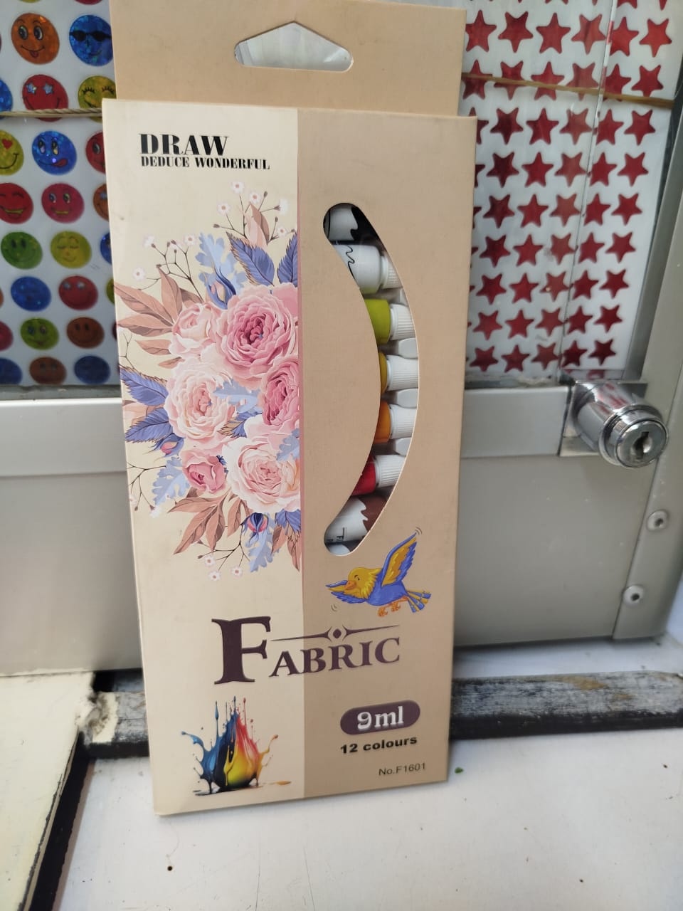 Draw Deduce Wonderful fabric paints. 
The product is No. F1601 and contains 12 colours. 
Each tube contains 9ml of paint.
Fabric paints are designed to be permanent and flexible on textiles without cr