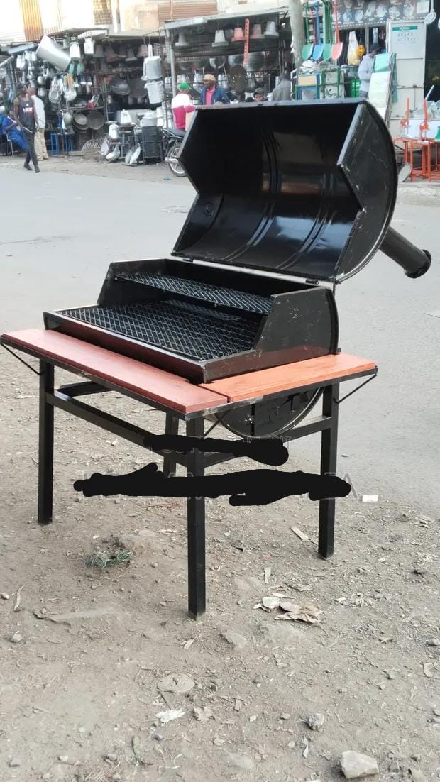 charcoal barbecue grill, commonly known as a "jiko" or "choma grill"  These grills are often handcrafted locally from upcycled barrel drums and high-quality mild steel. 

Durable Construction: Built t