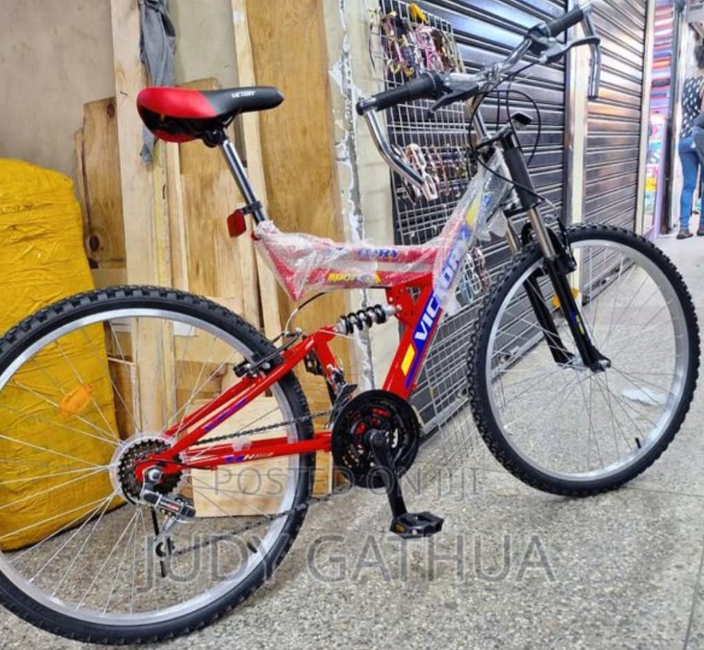 Size 26 red and black Victory full-suspension mountain bike. 
The bicycle features both front and rear suspension to handle varied terrain. 
It has a sturdy frame designed for durability.