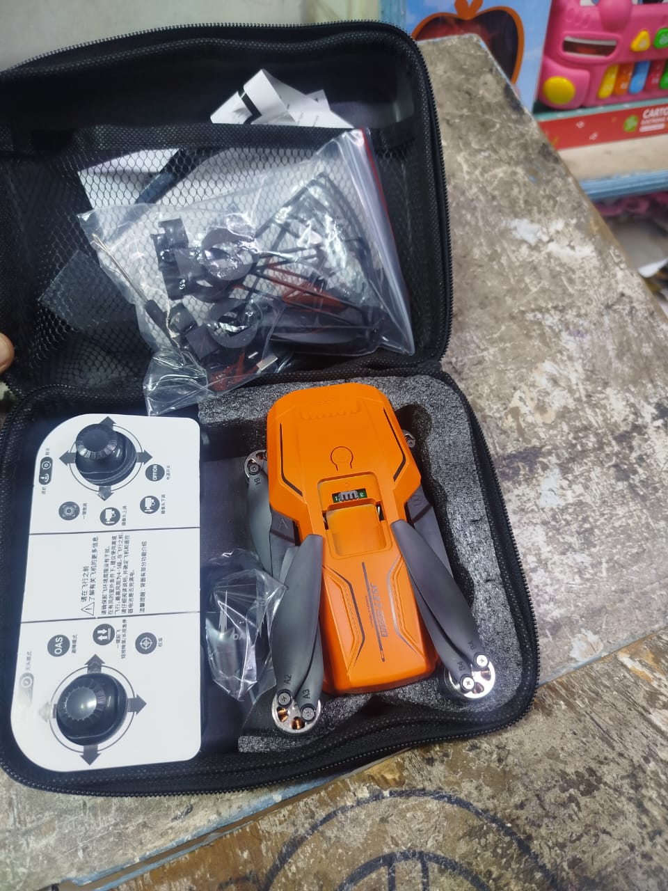 KF102 drone and its accessories in a carrying case. This model is a foldable, professional-grade quadcopter often used for aerial photography and videography. 
Key features and shopping information in