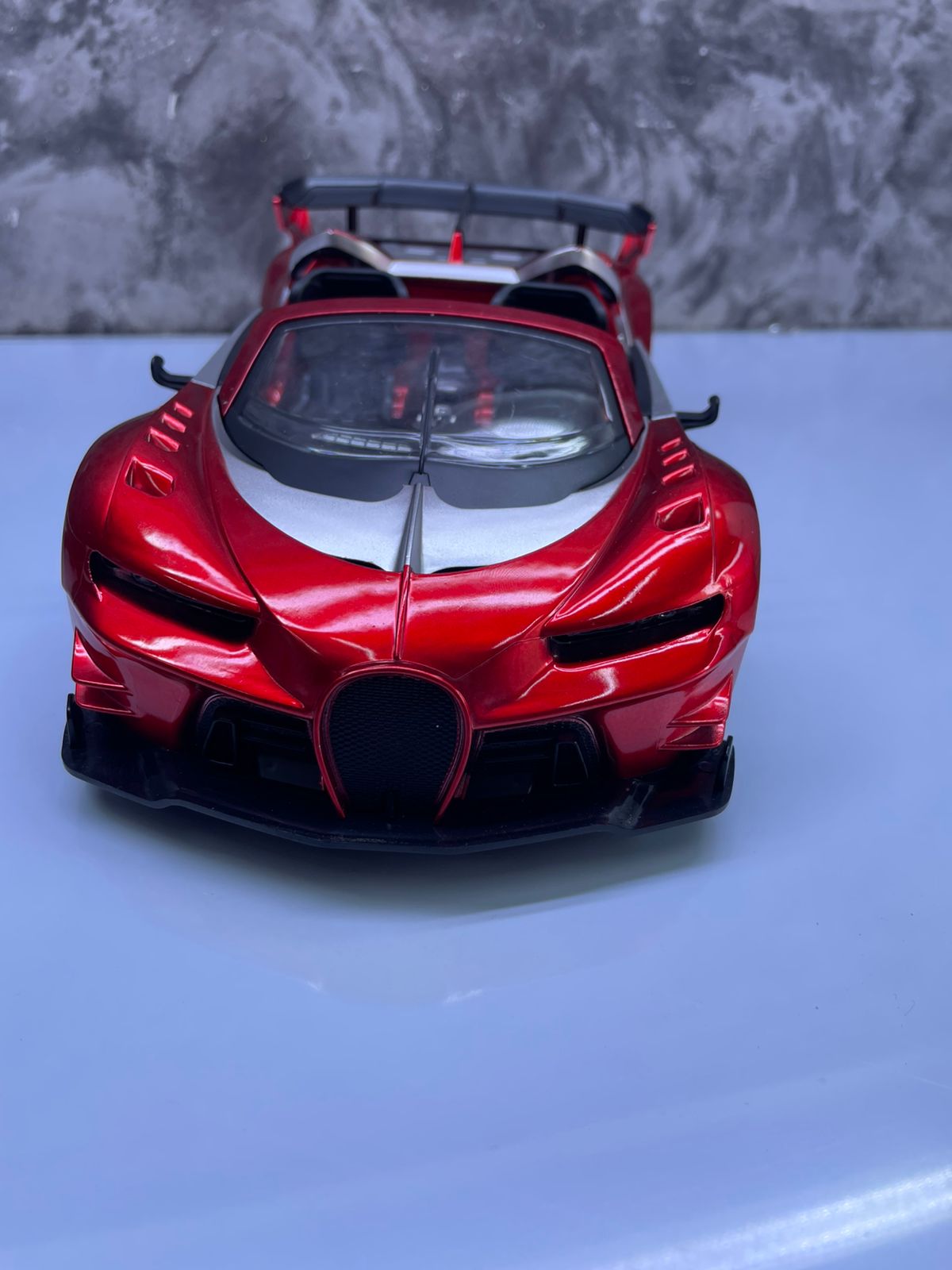🎊Discounted Offers 🎊BUGATTI RECHARGEABLE REMOTE CONTROL TOY CAR. Typically made of ABS plastic with a glossy paint finish. Moves forward, backward, left, and right, controlled by a 2.4 GHz remote.
