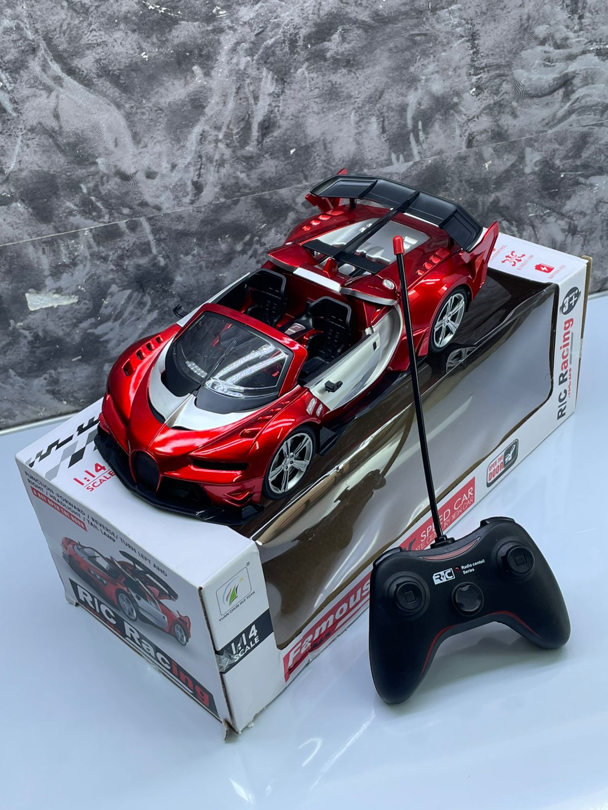 🎊Discounted Offers 🎊BUGATTI RECHARGEABLE REMOTE CONTROL TOY CAR. Typically made of ABS plastic with a glossy paint finish. Moves forward, backward, left, and right, controlled by a 2.4 GHz remote.
