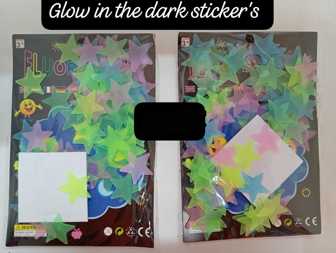 2packs glow-in-the-dark star stickers. These fluorescent stickers are designed to be applied to walls or ceilings to create a starry night effect in a room. 
How they work: The stickers absorb light d