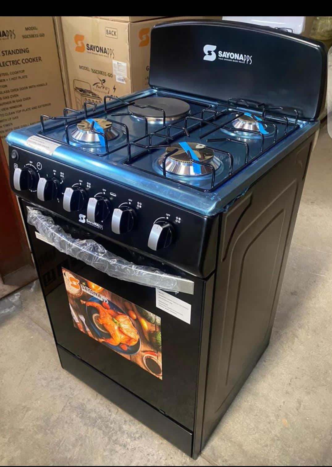 Sayona 3 Gas + 1 Electric Plate Standing Cooker.
It features three gas burners and one electric plate, with an electric oven. 
The cooker has a stainless steel cooktop and a double glass oven door. 
I