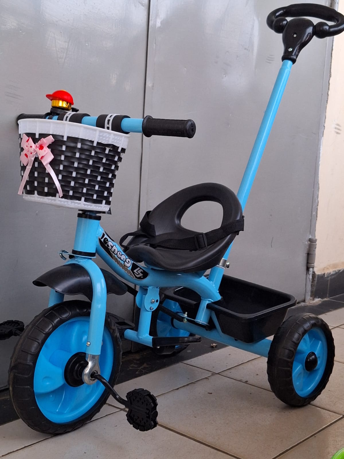 tricycle with push handle and basket