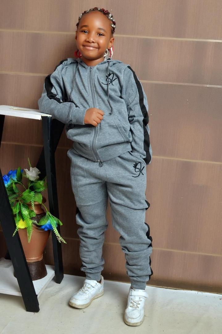 Kids Warm Unisex Track Set, also commonly referred to as a tracksuit, for children. 
This type of clothing typically includes: 
Hoodie/Jacket: A hooded top or jacket with a zipper closure, often made