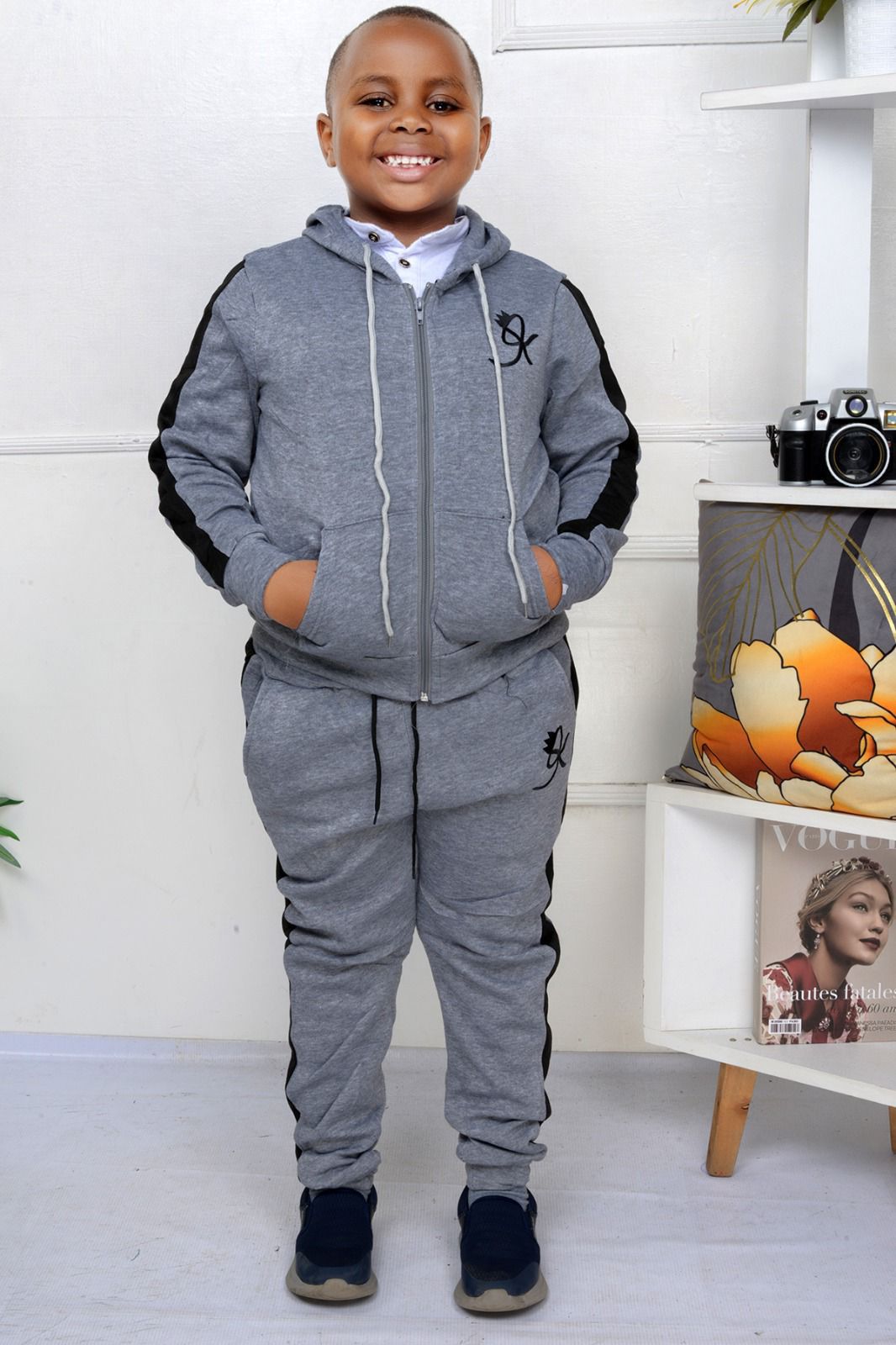 Kids Warm Unisex Track Set, also commonly referred to as a tracksuit, for children. 
This type of clothing typically includes: 
Hoodie/Jacket: A hooded top or jacket with a zipper closure, often made