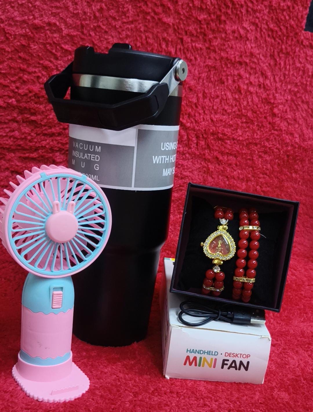 ♦️900 ml insulated mug(can keep hot or cold 
♦️ portable fan 
♦️ Watch+bracelet+gift box
♦️