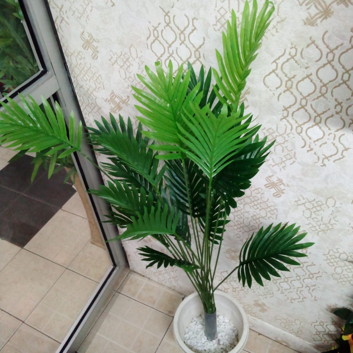 Palm tree in plastic vase and pebble stones 4 feet long