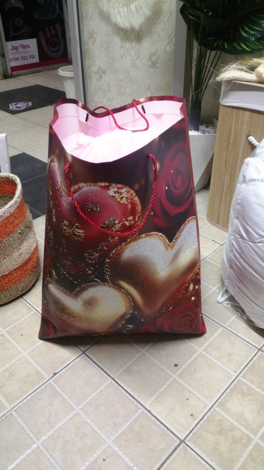 Valentine Teddy bear 40cm long and a bunch of wrapped artificial flowers and in a gift bag