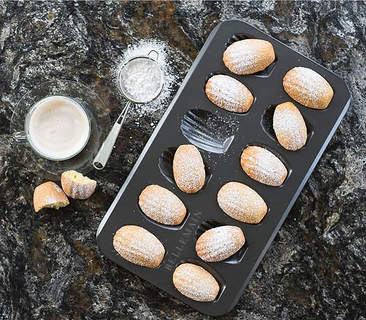 High Quality 12 slots Nonstick Cookie madeleines baking tin Heavy Duty Seashell Shaped Baking Cake Mold. (Black), Alloy Steel
video has a nice demo                                                    .