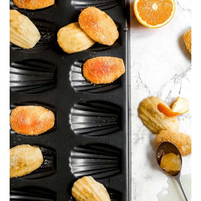 High Quality 12 slots Nonstick Cookie madeleines baking tin Heavy Duty Seashell Shaped Baking Cake Mold. (Black), Alloy Steel
video has a nice demo                                                    .