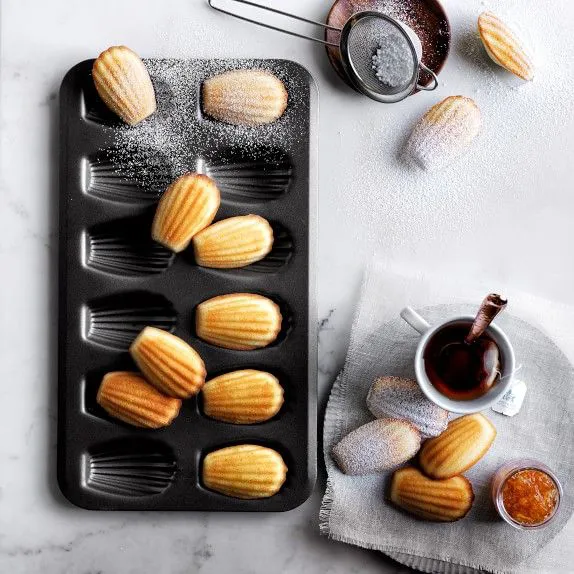 High Quality 12 slots Nonstick Cookie madeleines baking tin Heavy Duty Seashell Shaped Baking Cake Mold. (Black), Alloy Steel
video has a nice demo                                                    .