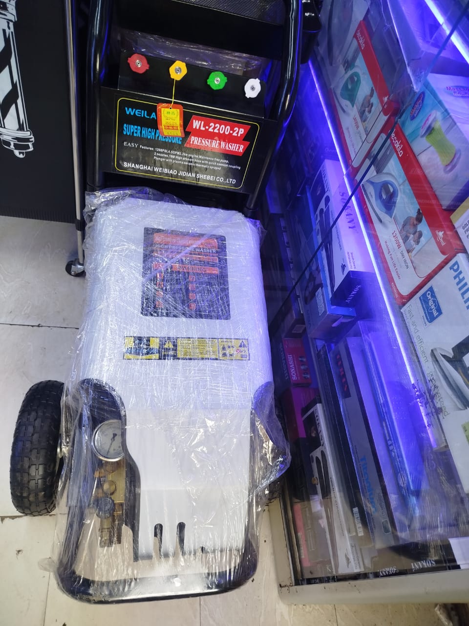 WEILA WL-2200-2P Super High Pressure Pressure Washer".
A pressure washer is a machine that uses a high-velocity stream of pressurized water to clean various surfaces. 
Function: It is used for heavy-d