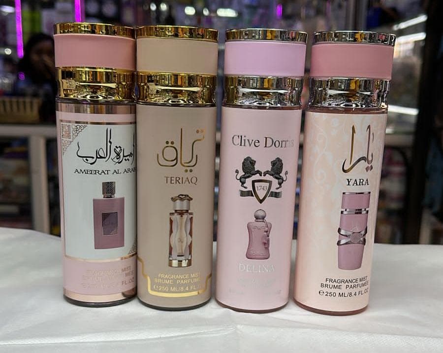 250ML fragrance mists, body mists or body sprays. The bottles are labeled with different brands and scents.
Ameerat Al Arab: A fragrance mist with a pink and gold cap. 
Teriaq: A fragrance mis