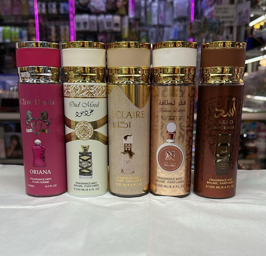 250ML fragrance mists, body mists or body sprays. The bottles are labeled with different brands and scents.
Ameerat Al Arab: A fragrance mist with a pink and gold cap. 
Teriaq: A fragrance mis