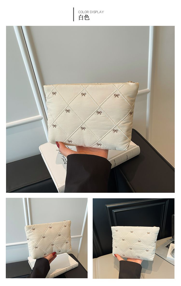 Butterfly knot pattern is fashionable and versatile. Quilted embroidery thread grid filled cotton makeup bag, casual hand-held bag, warm down small bag, inner bag, wash bag, pen bag, travel bag