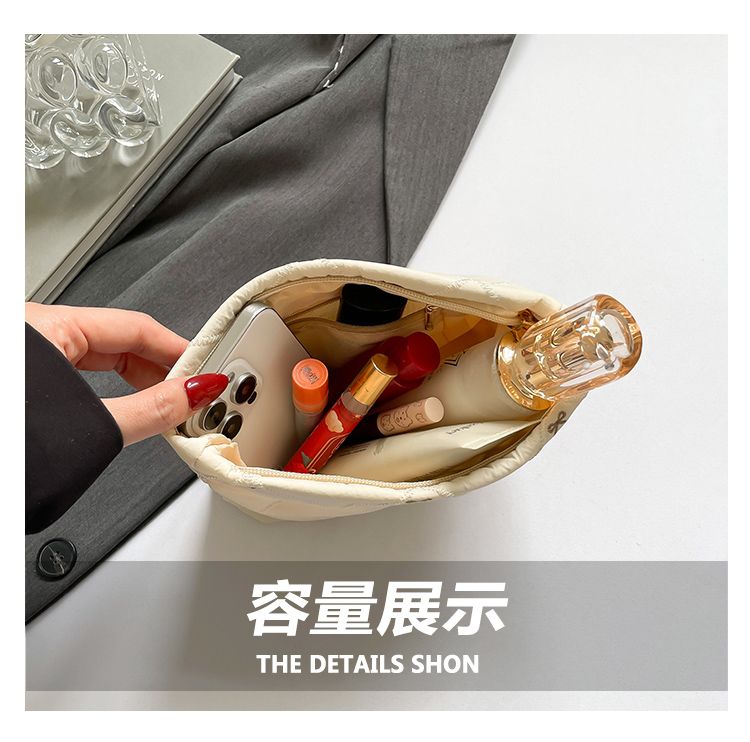 Butterfly knot pattern is fashionable and versatile. Quilted embroidery thread grid filled cotton makeup bag, casual hand-held bag, warm down small bag, inner bag, wash bag, pen bag, travel bag