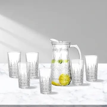 Deli Glassware from Redberry 7Pcs Water Set Which Includes 6pcs of 278ml of each Glass and 1pc Jug of 1.86ltrs with Lid Made of crystal material and is transparent Strong Glasses and Jug