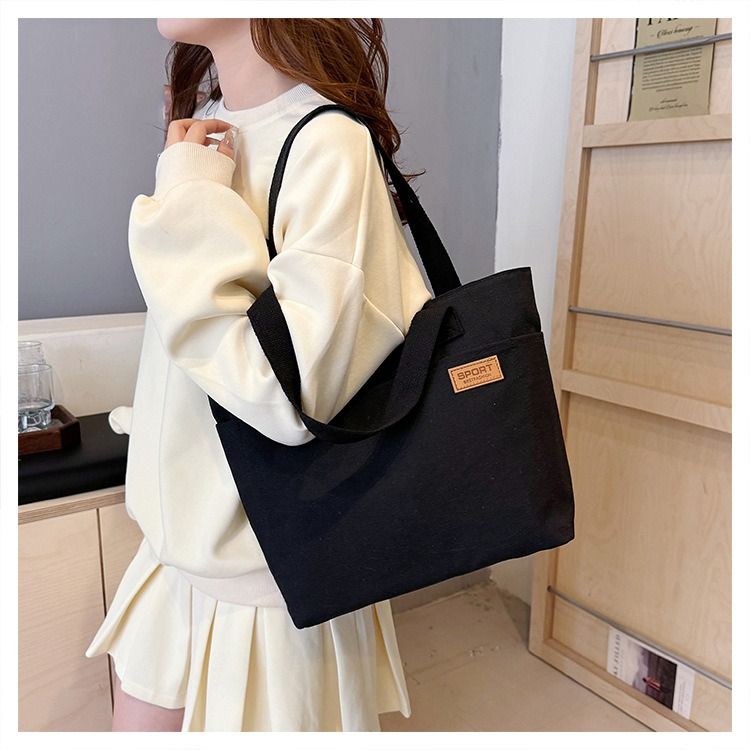 Student Canvas Tote Bag for School Simple Large Capacity Shoulder Bag Versatile Commuting Handbag Literary Style Casual Tote Reusable Handheld Cloth Shopping Bag for Women