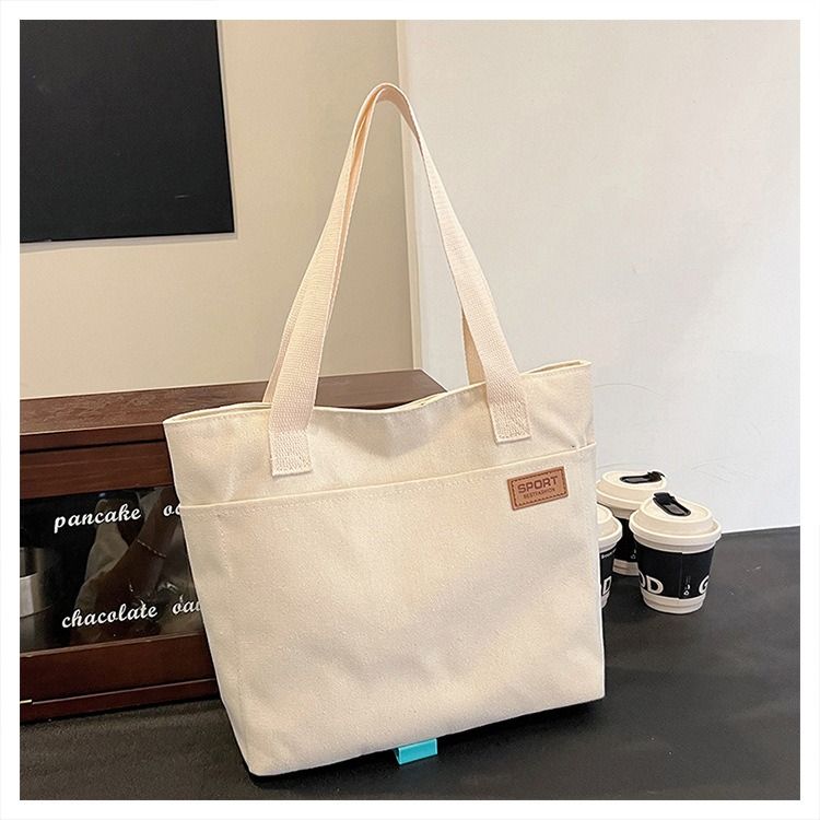Student Canvas Tote Bag for School Simple Large Capacity Shoulder Bag Versatile Commuting Handbag Literary Style Casual Tote Reusable Handheld Cloth Shopping Bag for Women