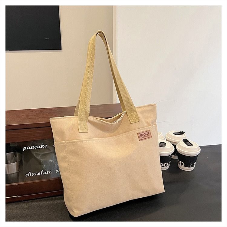 Student Canvas Tote Bag for School Simple Large Capacity Shoulder Bag Versatile Commuting Handbag Literary Style Casual Tote Reusable Handheld Cloth Shopping Bag for Women
