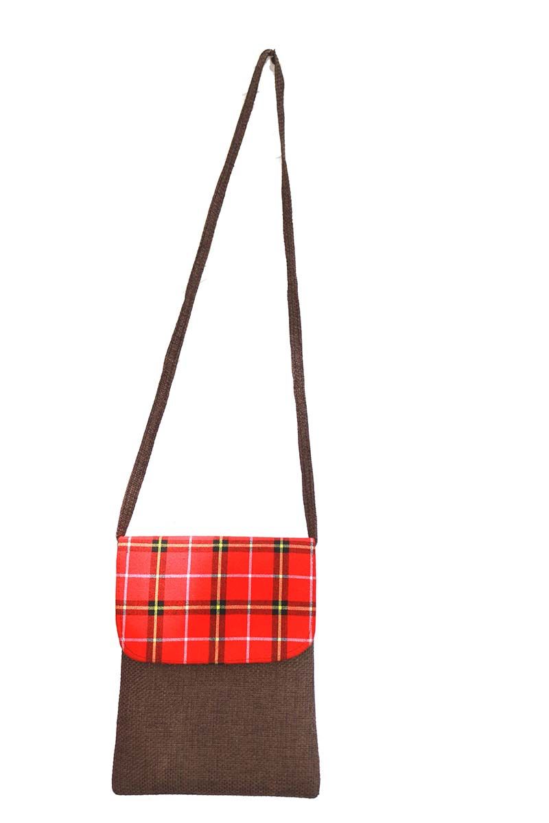A Maasai shuka print hand-woven sling bag is a vibrant fusion of traditional Maasai textile artistry and contemporary fashion sensibilities.