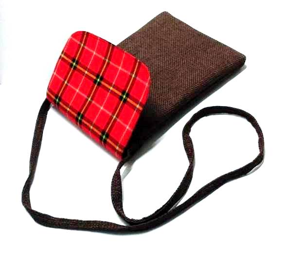 A Maasai shuka print hand-woven sling bag is a vibrant fusion of traditional Maasai textile artistry and contemporary fashion sensibilities.