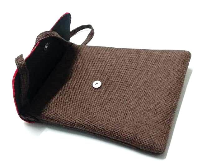 A Maasai shuka print hand-woven sling bag is a vibrant fusion of traditional Maasai textile artistry and contemporary fashion sensibilities.