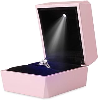 a baby pink LED ring box designed to transform the act of proposing Opening this exquisite box reveals its true allure