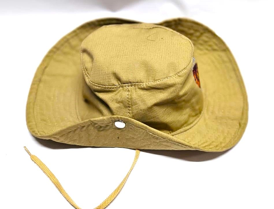 brown safari hat Crafted from high-quality, durable materials  blends practicality with a touch of sophistication