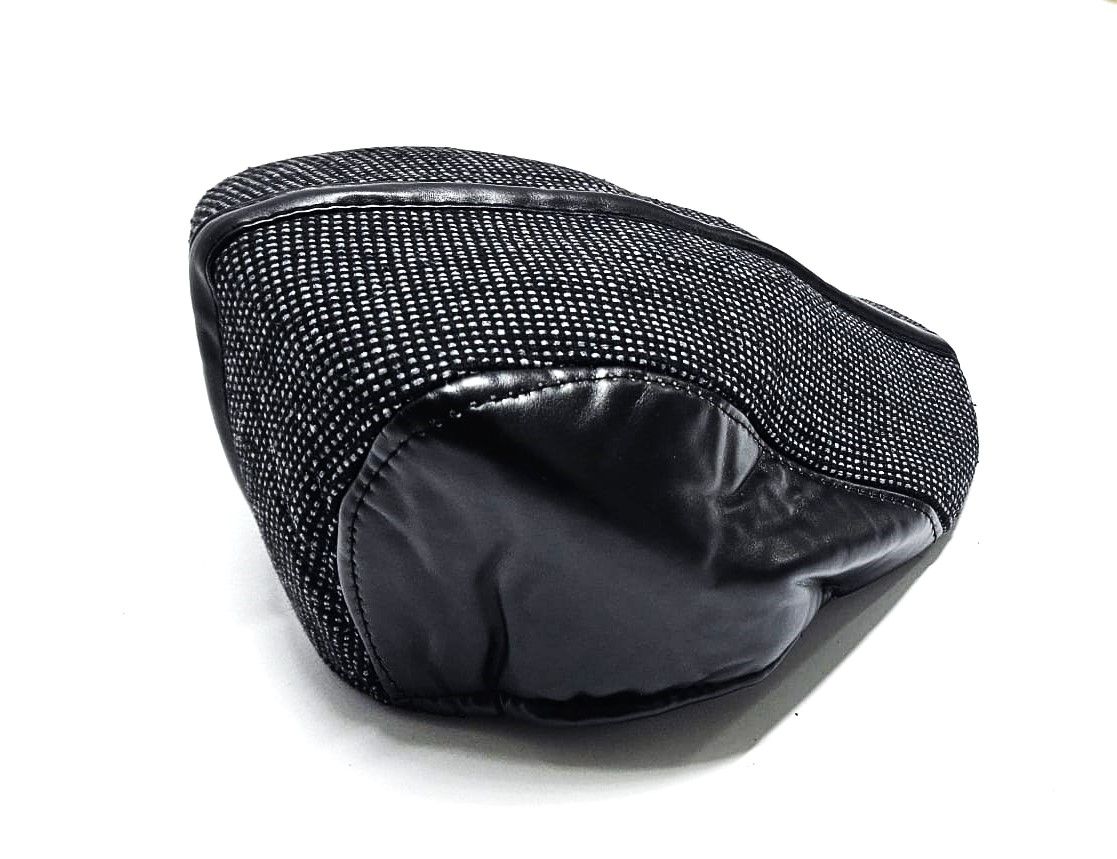 black checked newsboy cap, a timeless accessory, effortlessly combines vintage charm with contemporary flair