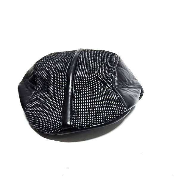 black checked newsboy cap, a timeless accessory, effortlessly combines vintage charm with contemporary flair