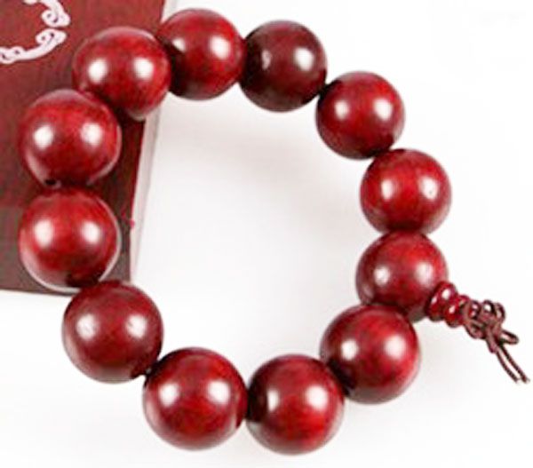 maroon Shamballa bracelet, adorned with large beads, exudes an aura of elegance