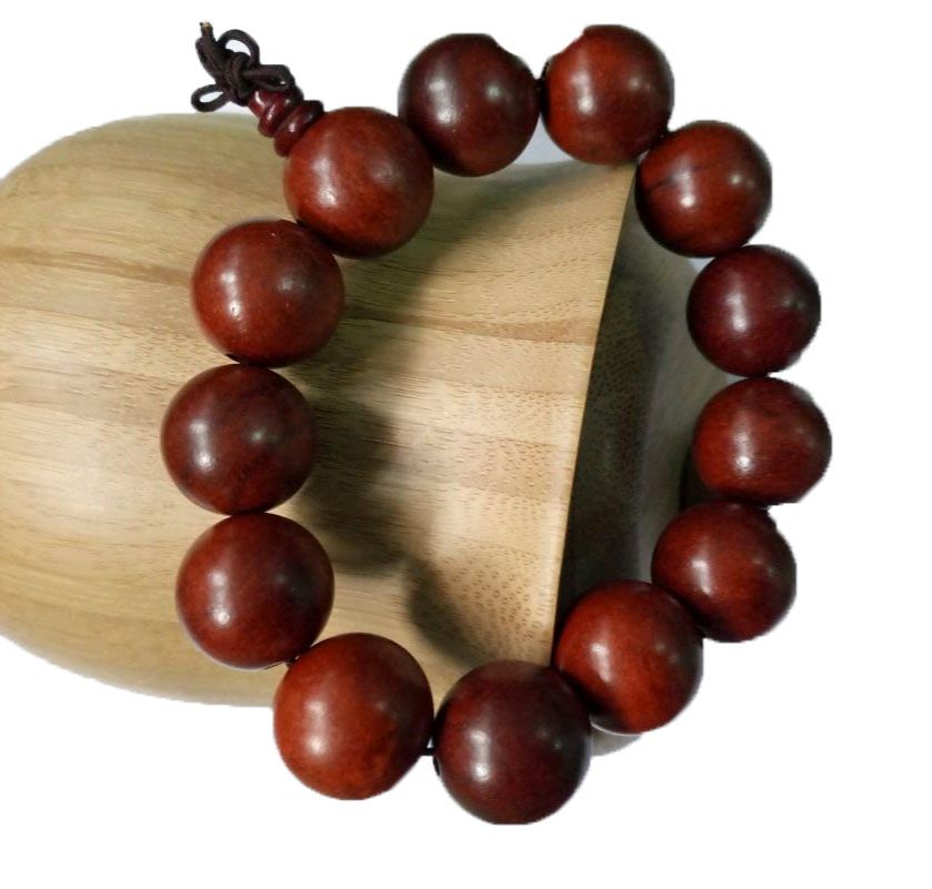 maroon Shamballa bracelet, adorned with large beads, exudes an aura of elegance