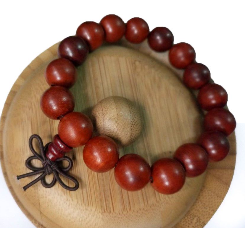 maroon Shamballa bracelet, adorned with large beads, exudes an aura of elegance