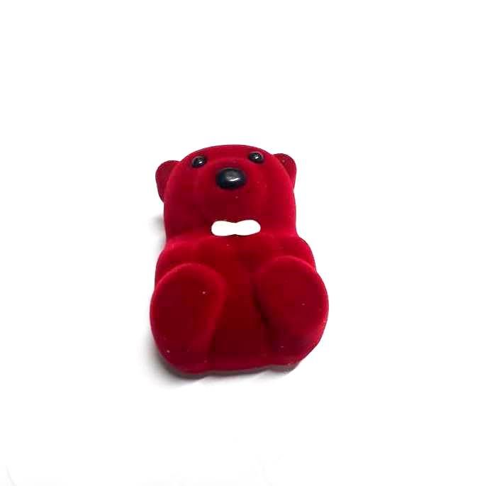 charming red velvet ring box, designed in the shape of a teddy bear, is the perfect fusion of elegance and whimsy,